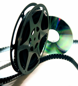 8mm film reel and silver DVD.