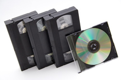 A collection of S-VHS videotapes and a DVD.