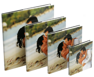 Photo books of various sizes with photo wrapped covers.