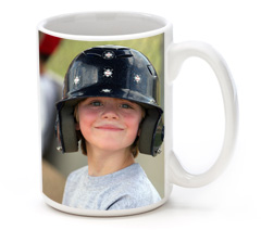 Photo mug with small boy and big baseball batter's helmet.